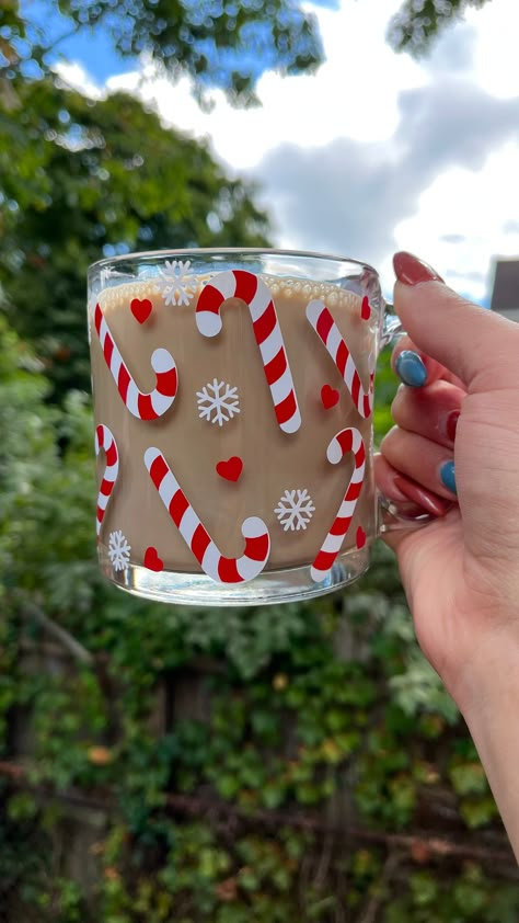 This libbey glass mug is the perfect holiday 🎄cup for all your holiday hot cocoas, peppermint mocha coffee and any holiday beverage you choose  🎄Details🎄 13oz clear glass mug  Design is made from  High quality, permanent vinyl that will withstand daily use and washings.  I strive for consistency and perfection, however, every item is hand-made with love, which means they may vary in color, size, etc.  Care Instructions:  Handmade with Love, So Handle with Care! Each cup comes with a care card Painting Christmas Mugs Ideas, Holiday Cup Design, Christmas Mug Vinyl, Clear Mug Cricut Ideas, Christmas Vinyl Mugs, Christmas Cricut Mug, Clear Glass Mugs, Vinyl Christmas Mugs, Glass Cups With Vinyl Christmas