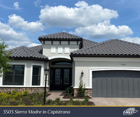 Dark Grey Roof House Exterior Paint, Houses With Dark Roof, Black Spanish Tile Roof, Dark Gray Roof House Colors, Exterior House Colors With Metal Roof, Gray Roof House Colors Exterior Paint, White And Gray House Exterior Modern, Gray Roof House, Dark Roof House Color Schemes