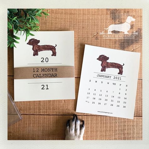 We’ve added a NEW calendar design for 2021! It’s our CPO (Chief Puppy Officer) drawn by his 6-year-old hooman sister to help spread some doxie cheer to the new year. All 2021 calendars are now 20% off and ship free: www.pickledogdesign.com Dog Drawing Dachshund, Drawing Dachshund, 12 Month Calendar, Display Easel, Desktop Calendar, 2021 Calendar, Green Bows, Packaging Supplies, Wiener Dog