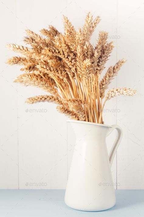 Ripe wheat in white vase on wooden background by sunapple. Bouquet of ripe wheat on blue and white wooden table, vintage harvest background, copy space#wooden, #background, #sunapple, #vase Fake Wheat Decor, Dried Wheat In Vase, Vintage Harvest Decor, Wheat Decorations Decorating Ideas, Wheat Table Decor, Wheat In Vase, Dried Wheat Decor, Wheat Vase, Harvest Background