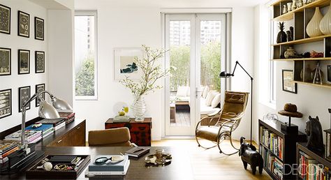 Lisa Pomerantz Manhattan Home - Upper East Side Homes - ELLE DECOR. In the study, the iron-and-brass rocking chair by Robert W. Winfield originally belonged to Pomerantz's father; the 19th-century chest is Japanese, and the print above it is by Isabel Bigelow; the vintage desk lamps are by Jean Prouvé, the 1950s floor lamp is French, and the metal bookcases are by Tomas Maier for Bottega Veneta. Eastern Promises, Decorating Bookshelves, Decoration For Ganpati, Moody Interiors, Study Area, High Fashion Home, Moving House, Lounge Room, Home Office Design