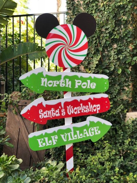 This adorable Disney inspired Christmas yard decoration stands 36 inches tall and 18 inches wide. It is made on a wooden stake and PVC and vinyl arrow sign! It is UV protected and sealed to allow it to be weather resistant. Due to these items being seasonal, All items are final sale and are not exchangeable Or returnable. Wooden Stake, Disney Christmas Decorations, Candy Cane Decorations, Christmas Cutouts, Arrow Sign, Christmas Party Themes, Candy Land Christmas Decorations Diy, Candy Land Christmas Decorations Outdoor, Christmas Yard Decorations