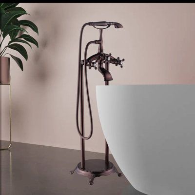 A key element of any claw-foot tub setup is a faucet that is both functional and aesthetics. This floor-mounted clawfoot tub faucet trim (with diverter and hand shower) has a flow rate of 2.5 gallons per minute, so you'll be high and dry in no time. Its sturdy brass construction ensures it will last for years, and it comes in a variety of metal finishes, so you can choose which one works best for your master bathroom. Choose it for a pleasant bath time! Finish: Oil Rubbed Bronze | PENGFANG WORLD High And Dry, Clawfoot Tub Faucet, Clawfoot Tub, Tub Filler, Tub Faucet, Hand Held Shower, Clawfoot Bathtub, Metal Finishes, Bath Time