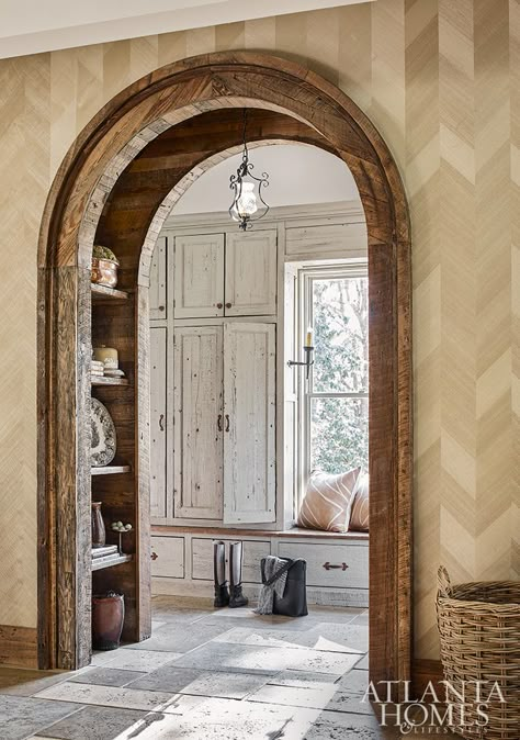 Going Country - Atlanta Homes and Lifestyles Arched Doorway Hallway, House Archway Ideas, Rounded Hallway Entrance, House Arches Interiors, Trim Around Arched Windows, Arched Barn Doors In The House, Unique Doorways Interior, Wallpaper Archway, Making Arched Doorways