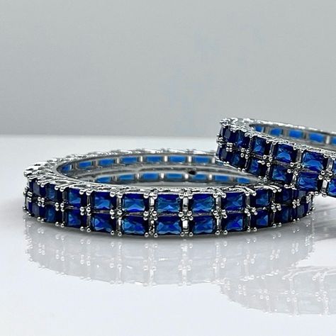 Make a statement with our Midnight Blue Bangle Set, a touch of luxury for any occasion 💎 ✨ Dm us to place an order 📲 #avirasjewellery #bangles #bangleset #bluediamond #midnightblue #adbangles #americandiamondjewellery #jewellerydesign #jewellerylover Luxury Blue Bangle Jewelry, Elegant Blue Diamond Bangle, Blue Bangles Set, Luxury Traditional Blue Bangle, Blue Resizable Bangle Jewelry, Placing An Order, American Diamond Jewellery, Place An Order, April 20