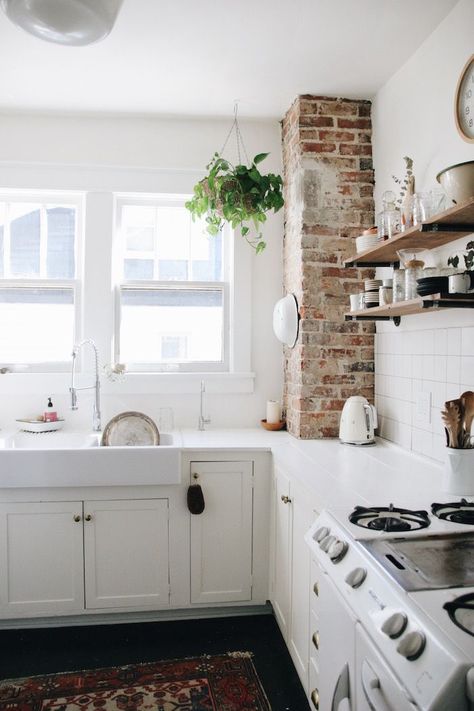 Inside the Nashville Home of an Airbnb Instagram Star Brick Chimney In Kitchen Exposed, Exposed Brick Pillar, White Wash Chimney, White Kitchen Exposed Brick, Kitchen With Exposed Brick Chimney, Brick Pillar Kitchen, Brick Corner Wall, Brick And White Kitchen, Kitchen With Brick Chimney