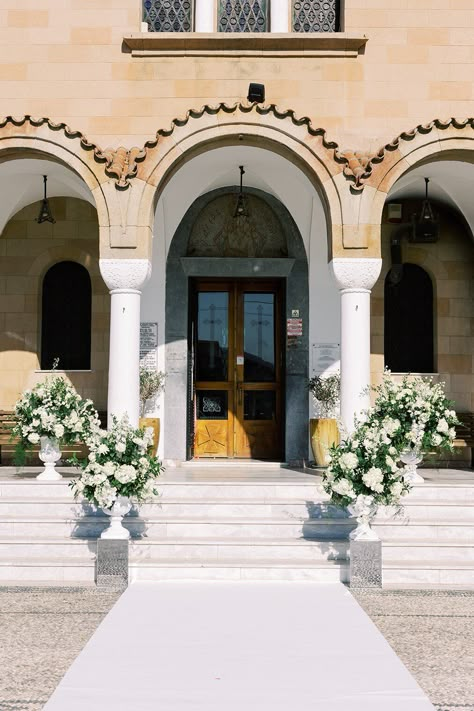 Elegant Orthodox Greek - American Wedding Style Ceremony at Faliraki St. Nektarios Church. Modern Themed Wedding Reception: Kallithea Springs, Rhodes. Color Palette: White, Green, Sage & Mix Metals. Greek Destination Wedding Planned by Golden Apple Weddings. Bride & Groom Wedding Portraits Couple Wedding Photoshoot #weddingtheme #weddingdecor #weddingevent #weddingphotography #weddingplanning #destinationweddings #Greece #orthodoxwedding #ceremony #church #entrance #carpet #urns #flowersynthesis Greek Church Wedding, Church Entrance Wedding Decorations, Church Entrance, Apple Wedding, Orthodox Wedding, Greek Orthodox Church, Church Wedding Decorations, American Wedding, Destination Wedding Planning