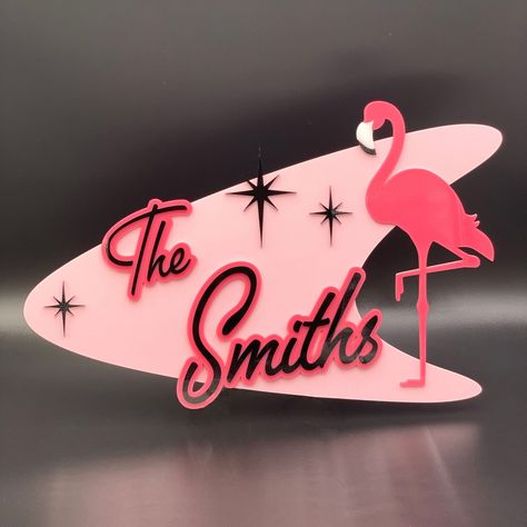 Atomic Flamingo 3D Mid Century Modern Family Name Sign

A unique and stylish way to welcome guests to your home, this 3D house address sign features a mid-century modern design with an atomic flamingo motif. Made of durable acrylic, it's perfect for both indoor and outdoor.#laserdecor #cuttingedge #homedecor #lasercutart #decorinspo Atomic Decor, Address Signs, Cocktails Sign, Family Name Sign, Century Decor, Retro Sign, The Smiths, Mid Century Modern Decor, Family Name Signs