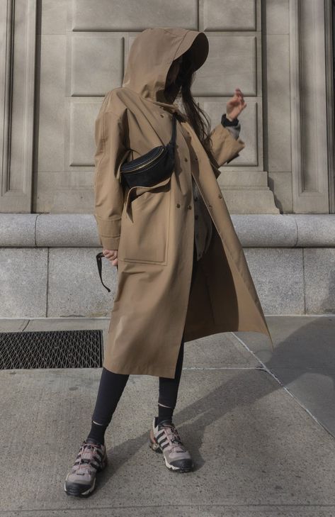 Fabric: 73% Cotton, 27% NylonColor: Light BrownCare: Hand wash / Dry clean Waterproof oversized hooded trench coat with two front pockets and centre front bottom closure. The length is 46-47 inches (118-120 cm). Unlined. Consider wearing at a temperature 68-50°F (20-10°C) Made in USA. Long Parka Outfit, Yellow Parka, Waterproof Trench Coat, Pijamas Women, Oversized Parka, Winter Coat Outfits, Rain Trench Coat, Khaki Trench, Khaki Trench Coat