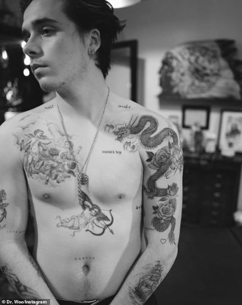 David Beckham Tattoos, Mia Regan, Neo Tattoo, Romeo Beckham, Nerd Tattoo, Brooklyn Beckham, Angel Tattoo Designs, Eagle Tattoo, Stomach Tattoos