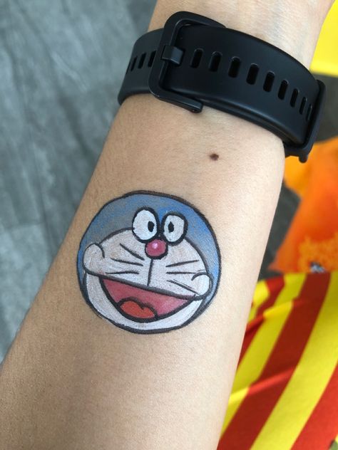 Doraemon Doremon Painting Ideas, Doraemon Tattoo, Arm Painting, Drama Songs, Head Tattoos, Tattoos For Kids, Hand Tattoo, Car Painting, Face Painting