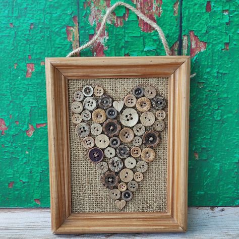 A small picture.(7 × 5.5 inches) A heart made of different buttons on burlap and framed in a wooden frame. The frame has delicate scuffs.. it looks little aged, which gives it a rustic look. The back of the picture is nicely decorated with paper. You can write congratulations or wishes to the person to whom this picture will be presented. You can do it yourself or I will write any text beautifully - just let me know, please. The picture will be packed in a beautiful gift box that I will make mys Heart Button Art, Valentine Frame Ideas, Button Wall Art, Button Art Projects, Buttons Crafts Diy, Framed Burlap, Valentines Frames, Button Frames, Button Picture