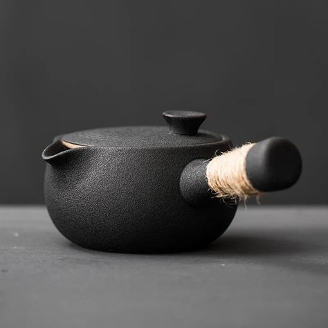 Japanese Style Handmade Rough Pottery Side Handle Teapot. This wabi-sabi teaware is a harmonious blend of functionality and rustic elegance. Japanese Ceramic Teapot, Asian Dinnerware, Japanese Tea Pot, Wabi Sabi Ceramics, Tea Warmer, Black Pottery, Teapot Design, Making Tea, Tea Making