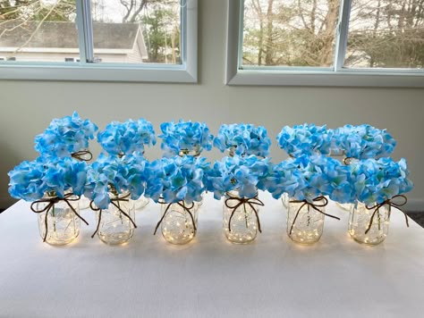 Light up your wedding, parties or events! Included is a package of 12 lighted mason jars with twine and hydrangeas. We can do color ribbon instead of twine if you would like.. Just message us with your request. There is 6 quart lighted jars and 6 pint lighted jars in this listing. The lights last 72 hours and a screwdriver is included to change batteries when needed. These lighted jars receive many compliments from guests. You can mix hydrangea colors also.. Just leave a note to seller at checko Lighted Wedding Centerpieces, Mason Jars With Twine, Lighted Mason Jars, Budget Friendly Wedding Centerpieces, Jar Centerpiece Wedding, Blue Hydrangea Wedding, Wedding Centerpieces Mason Jars, Rustic Beach Wedding, Mason Jar Centerpiece