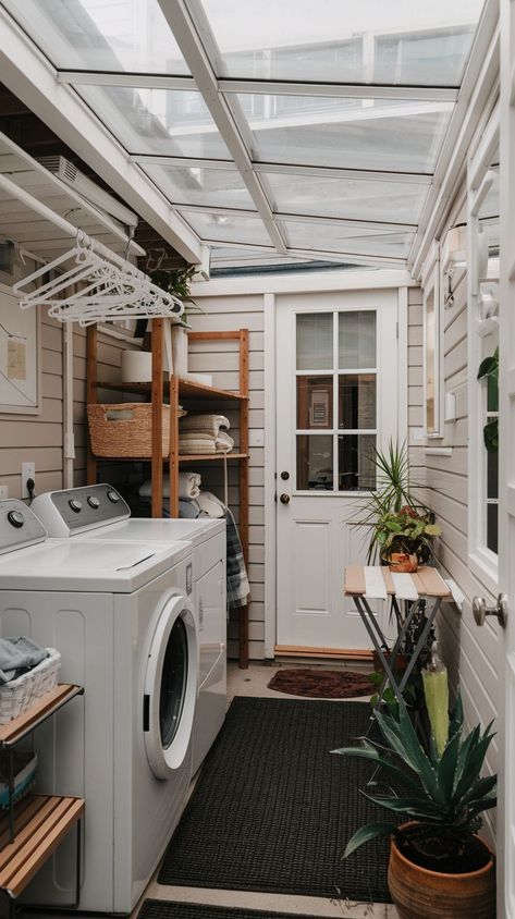 Maximize your laundry space with these 13 space-efficient ideas tailored for tiny laundry rooms. Learn how to incorporate smart storage, creative shelving, and multifunctional solutions to transform your small laundry area into a practical and stylish space. Small Laundry Area In Kitchen, Laundry Room Outside The House, Back Porch Laundry Room Ideas, In Unit Laundry, Small Kitchen And Laundry Combined, Small Laundry Room Drying Rack, Laundry Room Addition Exterior, Outside Washer And Dryer Ideas, Small Outdoor Laundry Area