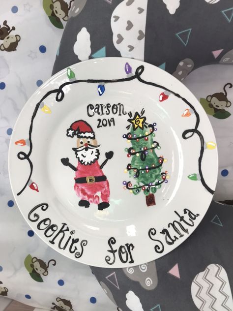 Infant baby footprint cookie plate Diy Milk And Cookies For Santa, Baby Santa Cookie Plate, Baby First Christmas Plate, Santas Cookies Plate Diy, Santa Cookie Plate Diy, Christmas Cookie Plate Diy Kids, Baby Christmas Plate, Diy Cookies For Santa Plate, Diy Santa Plate