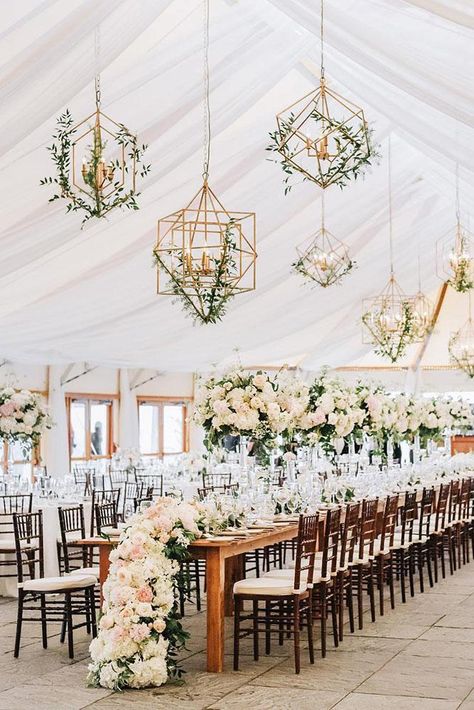 summer wedding trends reception under the tent with tall centerpieces white flower table runner and hanging geometry candles with greenry lenamirisola Floral Chandelier Wedding, Wedding Reception Design, Tafel Decor, Wedding Chandelier, Elegant Wedding Reception, Tent Decorations, Flower Table, Wedding Floral Centerpieces, Floral Chandelier