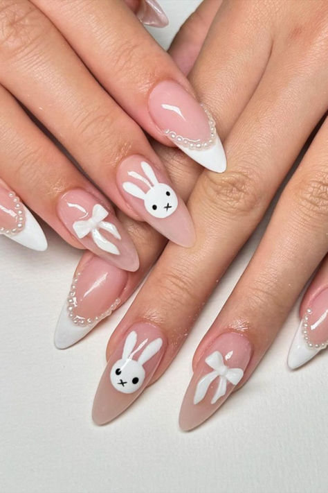 Achieve timeless elegance with a classic French manicure complemented by charming bunny nail art by @lolliesbeautiq, adding a playful touch to your sophisticated look.  Explore the best 25 bunny nail design ideas on Nailustrous – your go-to source for creative nail inspiration! 🐰💅 Bunny Nail Design, Easter Nails Bunny, Cute Bunny Faces, Bunny Nail Art, Rabbit Silhouette, Nail Coat, Bunny Nails, Asian Nails, Gel Powder