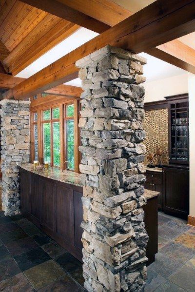 Stone Rock Wall Covered Basement Pole Ideas Basement Pole Ideas, Basement Pole Covers, Basement Poles, Low Ceiling Basement, Reclaimed Building Materials, Column Covers, Rustic Basement, Outdoor Structure, Stone Pillars