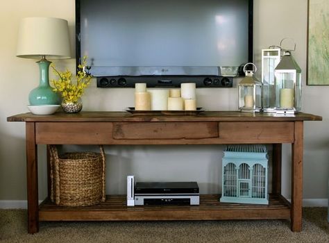 wall mounted tv console | Wall mounted TV with console table underneath: I really like how they ... Tv Display Ideas Living Room, Under Tv, Rustic Console Tables, Thrifty Decor Chick, Mounted Tv, Style At Home, Tv Wall, Home Fashion, Apartment Living