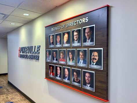 Board of directors photo display for Pikeville Medical Center by signgeek. Signage comes in different shapes, sizes and materials. Have a creative recognition sign idea outside the box? We can customize just about anything you want. #recognition #display Award Plaque Wall Display Ideas, Award Wall Display Ideas School, Certificate Wall Display Ideas Office, Wall Of Recognition Ideas, Office Award Wall, Awards Showcase Wall, Balcony Glass Design, Trophy Shelf, Donor Recognition Wall