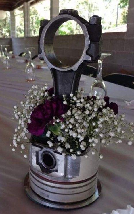 Piston centerpieces Mechanic Decorations Party, Dirt Bike Centerpiece Ideas, Race Theme Wedding Ideas, Piston Welding Art, Piston Centerpiece Wedding Ideas, Car Themed Wedding Centerpieces, Drag Racing Wedding Ideas, Motorcycle Wedding Decorations, Car Theme Wedding Ideas