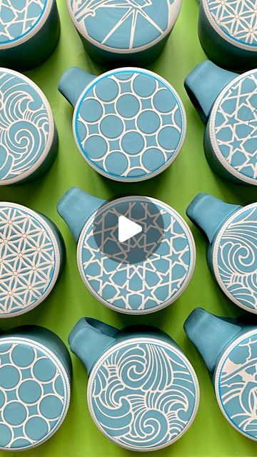 Renee LoPresti on Instagram: "🟢Colored slip [mug bottom] patterns 🟢 . I know I’ve been a bit quiet for the past couple of weeks; I have been busy throwing and prepping mugs, planters and tumblers for the decorating phase!  . Here I am using custom reusable die cut vinyl on leatherhard porcelain coffee mug bottoms. I like using a washable marker to mark where I want the slip to stop (and to ensure a perfectly centered circle). The vinyl is compressed onto the surface, and colored porcelain slip applied over the stencil.  . Each design corresponds with how the sides of the mug will be decorated (coming up next!). This slip will become a more vibrant blue-green color when fired. Happy Friday everyone!" Stencil Ceramics, Pottery Patterns, Washable Markers, Happy Friday Everyone, Cricut Creations, Vibrant Blue, Happy Friday, Cement, Green Color