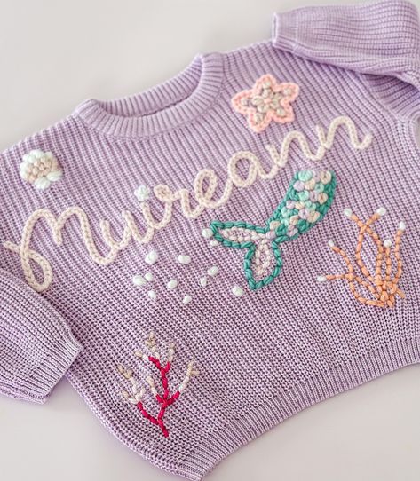 But what a cutie for Muireann 🥰😍 So thankful for customers trusting my little fingers! I will be adding a ‘custom/bespoke design’ option for this type of jumper. It’s clearly not just a name and design 😅 Embroidery Sweater Diy, Hand Embroidered Sweater, Embroidered Mermaid, Personalised Jumpers, Mermaid Custom, Mermaid Girls, Sweater Diy, Name Sweater, God Mother