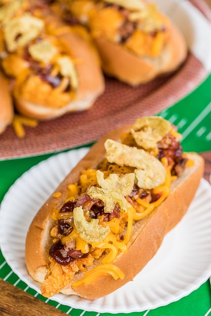 BBQ Bird Dogs - chicken fingers, bacon, cheese, BBQ sauce and fried jalapeños - perfect tailgating food! Easy to assemble in the parking lot! We also love to eat these for a quick lunch or dinner. #chicken #tailgatingrecipe #easychickenrecipe #chickenrecipe #chickenfingers #bbq Veggie Hotdogs, Fried Jalapeños, Tailgating Food, Easy Turkey Recipes, Party Sandwiches, Plain Chicken, Tailgating Recipes, Bird Dog, Finger Sandwiches