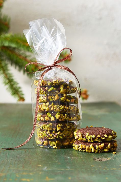 Skip the bag of pistachios this year — try these nutty, chocolate cookies instead. Click through to get the recipe and see more of the best Christmas cookies! #christmascookiesrecipes #christmasrecipes #christmasideas #christmascookieideas #christmascookieseasy بيتي فور, Slice And Bake Cookies, Italian Christmas Cookie Recipes, Edible Holiday Gifts, Italian Christmas Cookies, Chocolate Slice, Best Christmas Cookie Recipe, Pistachio Cookies, Delicious Christmas Cookies