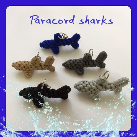 My new paracord sharks. I learned how to make the paracord dolphin from watching a video on YouTube, and modified it to look more like a shark. Shark Macrame, Paracord Gift Ideas, Paracord Animals Tutorials, Paracord Animals, Paracord Projects Tutorials, Parachute Cord Crafts, Plastic Thread, Paracord Crafts, Paracord Projects Diy