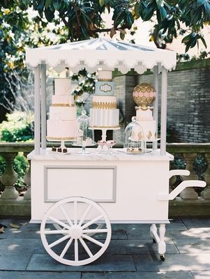 Wedding reception Paris theme dessert pastry cart with three cakes and macaron sphere with pastries Wedding Bar Cart, Dressing Stand, Dessert Cart, Gerobak Dorong, Display Tables, Paris Flowers, Sweet Carts, Parisian Wedding, Deco Champetre