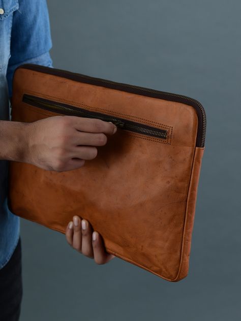 Upgrade your laptop protection with the stylish shield your laptop deserves. The Zento leather laptop sleeve is a stylish and functional accessory designed to protect your laptop while adding a touch of elegance. Crafted from high-quality genuine leather, it offers a premium look and feel. The sleeve features a slim, form-fitting design, ensuring a snug fit for your laptop. The interior is lined with soft materials to prevent scratches and provide extra cushioning. Overall, it combines aesthetic Leather Aesthetic, Leather Laptop Sleeve, Leather Work Bag, Leather Laptop Case, Dog Fashion, Leather Laptop, Leather Products, Functional Accessories, Leather Work