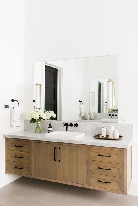 Floating vanities have a cool modern look and are perfect for aging in place clients. This beautiful vanity was designed by Studio McGee. #bathroom #bathroomideas #bathroomdesign Floating Vanity Bathroom, Modern Bathroom Mirrors, Modern Home Decor Bathroom, Bilik Air, Bathroom Vanity Designs, Traditional Bathroom Vanity, Vanity Design, Double Sink Bathroom, Floating Vanity