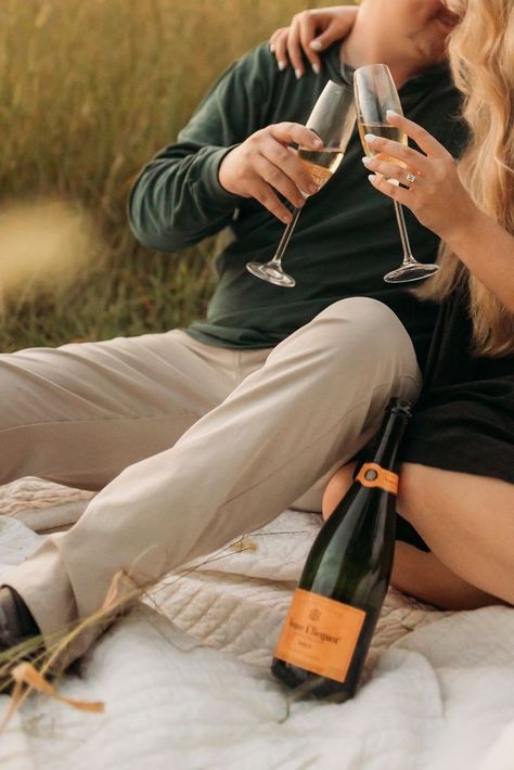 Champagne Golden Engagement Photos Champagne Glass Engagement Photos, Engagment Photo Champagne, Engagement Photo With Champagne, Gold Engagement Photos, Vineyard Couple Pictures, Charcuterie Engagement Photos, Pop Champagne Engagement Pictures, Champagne Couple Photoshoot, Engagement Pictures With Champagne