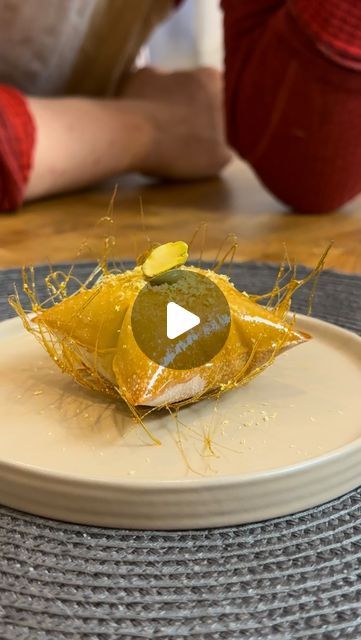 Chef Eitan D on Instagram: "Baklava inspired pillow (not for sleeping) 💤  Filo pastry pillow filled in a caramel nest filled with pistachio pastry cream and glazed with a lavender honey syrup   #dessert #cookingasmr #baklava #pistachio #recipes #creativedining #finedining #sweet  #privatechef" Unique Plated Desserts, Pistachio Plated Dessert, Dessert Fine Dining, Desert Plating, Unique Food Recipes, Cake Plating, Filo Pastry Dessert, Baklava Pistachio, Pistachio Pastry