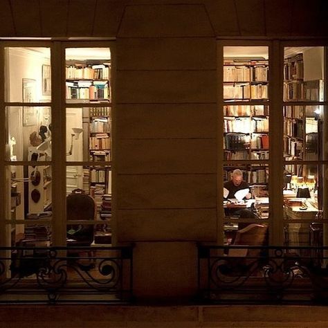 writer at home peering into a window at dusk Apartment At Night, Dusk Aesthetic, Pretty Library, Dreamy Apartment, Night Window, Library Room, Film Locations, New York Apartment, Beautiful Spaces