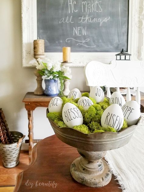 Rae Dunn Easter eggs in moss Egg Display Ideas, Easter Resurrection Eggs, Diy Osterschmuck, Egg Display, Rustic Easter Decor, Easter Decorations Vintage, Easter Decorations Christian, Easter Decorations Outdoor, Easter Decorations Diy Easy