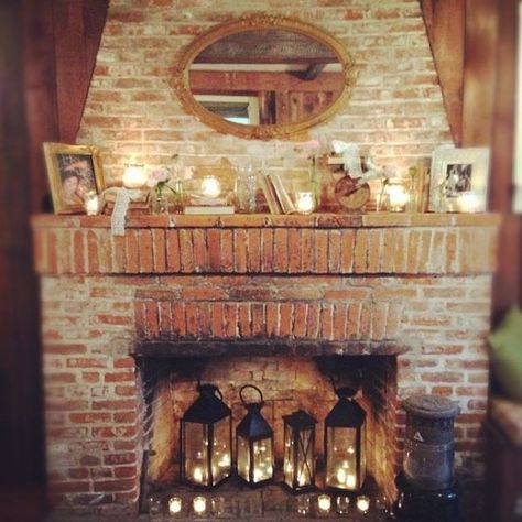 candle lanterns and tealights in the fireplace and candles in mercury glass candle holders Candles In Fireplace, Old Fireplace, Living Room Warm, Rustic Fireplaces, Faux Fireplace, Trendy Living Rooms, Fire Places, Trendy Bedroom, Cozy Fireplace