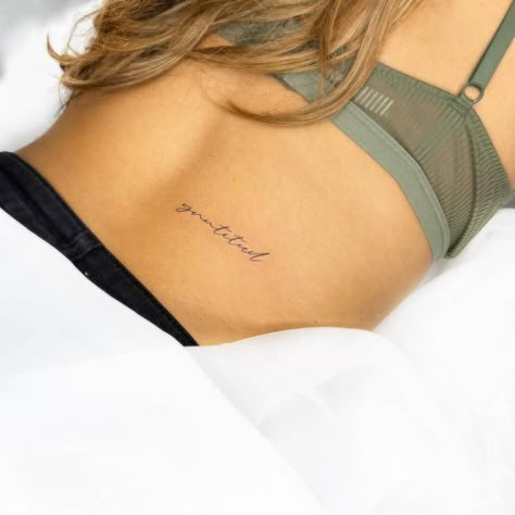 Lower Back Tattoos Writing, Lower Back Minimalist Tattoo, Lower Right Back Tattoos, Lower Back Script Tattoos, Back Tattoo Script, Gratitude Tattoo For Women, Gratitude Tattoos, Gratitude Tattoo Ideas, Tattoo Ideas Lower Back