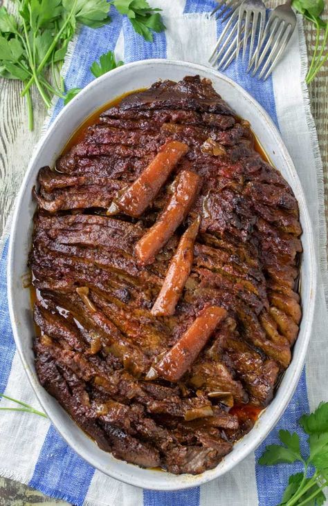 Oval casserole pan with slice braised brisket topped with four cooked carrot slices Braised Brisket, Resepi Biskut, Crockpot Recipes Beef Stew, Brisket Recipe, Beef Brisket Recipes, Recipes Beef, Brisket Recipes, Beef Recipe, Bbq Ribs