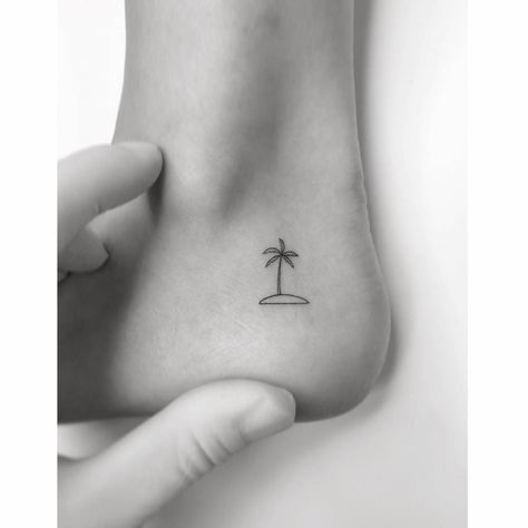 Minimalistic island and palm tree tattoo located on the Palm Tree Tattoo Ideas, Tree Line Tattoo, Palm Tree Tattoos, Back Of Ankle Tattoo, Tree Tattoo Ideas, Palm Tree Tattoo Ankle, Island Tattoo, Palm Tree Island, Tree Tattoos