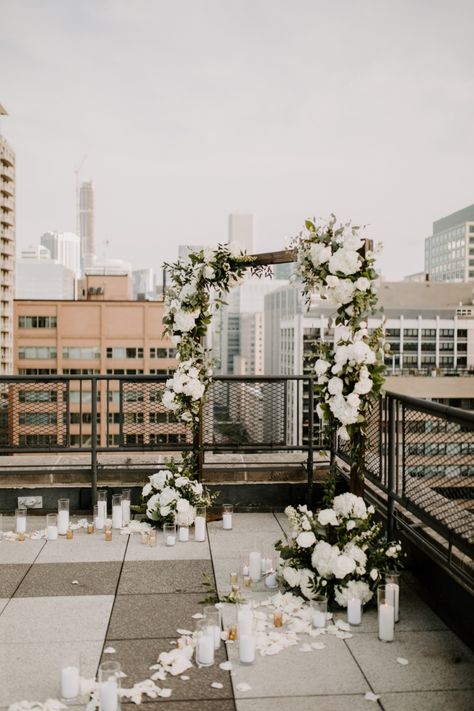 Want to know one way to seal the deal!? Ask Josh, who gave Morgan the proposal of her dreams! After taking Morgan to get a drink just down the street, Josh then led Morgan to the rooftop of the first apartment building that they lived in together, overlooking Lake Michigan and amidst the Chicago skyline. #firstapartment #weddingproposal  #inlove #wedding #engaged #floralarch #candlelitproposal Rooftop Wedding Decor, Rooftop Proposal, Rooftop Wedding Ceremony, Cute Proposal Ideas, Proposal Pictures, Rooftop Party, Rooftop Wedding, Wedding Proposals, Engagement Decorations