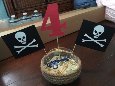 Pirate Party Centerpiece Pirate Centerpiece Ideas, Pirate Birthday Party Centerpieces, Pirate Table Decorations Centerpieces, Pirate Birthday Centerpieces, Pirates Table Decorations, Pirate Themed Office Party, Pirate Party Centerpieces, Diy Pirate Mast Centerpiece, Pirate Centerpiece