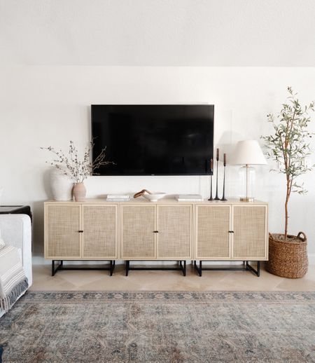 Two Sideboards Side By Side, Chic Tv Stand Ideas Living Rooms, Dresser With Tv Mounted Above Livingroom, Basket Under Mounted Tv, Media Stand Styling, Tv Over Sideboard, Two Tv Stands Side By Side, Neutral Living Room Tv Console, Baskets On Entertainment Center