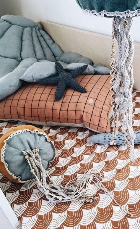 The best rugs for kids are those that are safe, comfortable, non-toxic, and easy to clean. Get to know more in our article! Crochet Tentacles, Pantone Azul, Baby Jellyfish, Casa Hobbit, Boho Kids Room, Hanging Items, Beads Crochet, Unique Fish, Baby Kostüm