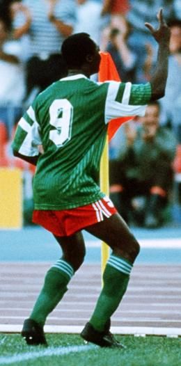 Roger Milla (Cameroon, 1973–1994, 102 caps, 28 goals) during the 1990 FIFA World Cup Italia quarter-final. He will always be remembered by football lovers for his original goal celebration with dancing belly rocking in the corner of the goal line. El Classico Football, Roger Milla, 1983 World Cup, Brazil 2002 World Cup, 1970 World Cup, Brazil 1958 World Cup, Sporting Legends, Football Icon, Association Football