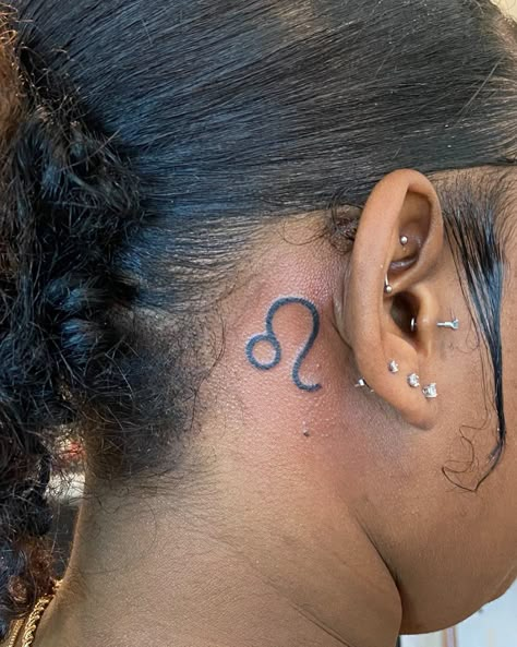 Glizzy on Instagram: “#tatmonster #tattoos #leo #behindeartattoo #tattooideasforgirls #tattooideas” Behind Ear Leo Tattoo, Leo Face Tattoo, Leo Tattoo Behind The Ear, Leo Symbol Behind Ear, Leo Sign Tattoo Behind Ear, Leo Tattoo Black Women, Leo Ear Tattoo, Leo Behind Ear Tattoo, Small Behind The Ear Tattoo Ideas Women