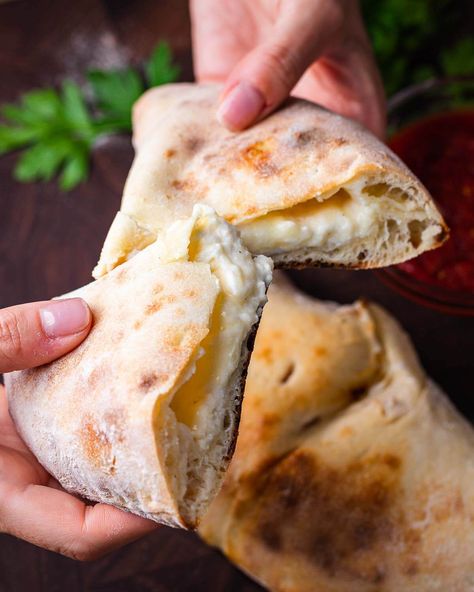 Pizzeria-style cheese calzone are handheld pockets made from pizza dough that's filled with a blend of ricotta, mozzarella, and Pecorino Romano cheese and served with a simple marinara for dipping. #cheesecalzone #calzonedough #pizzadough #calzonerecipe Cheese Calzone Recipe Ricotta, Calzone Recipe Ricotta, Calzone Recipe With Pizza Dough, Calzone Dough, Cheese Calzone, Pizza Dough Bread, Calzone Recipe, Pecorino Romano Cheese, Pecorino Romano