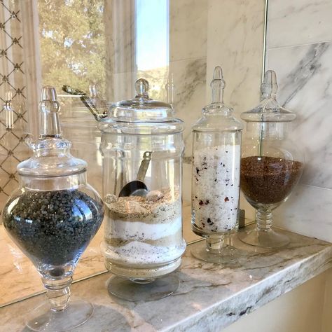 Organizer Tracy Bowers on Instagram: “From Bags to Beauty!  My smart 🤓client purchased these beautiful glass jars to display her bath salts. 🛁No more crinkled bags under the…” Bath Salts Storage Ideas, Bath Salt Organization, Bathroom Glass Jars, Bath Salt Container, Bath Salt Containers, Bath Salt Jars, Shower Niche, Apothecary Bottles, Bath Salt